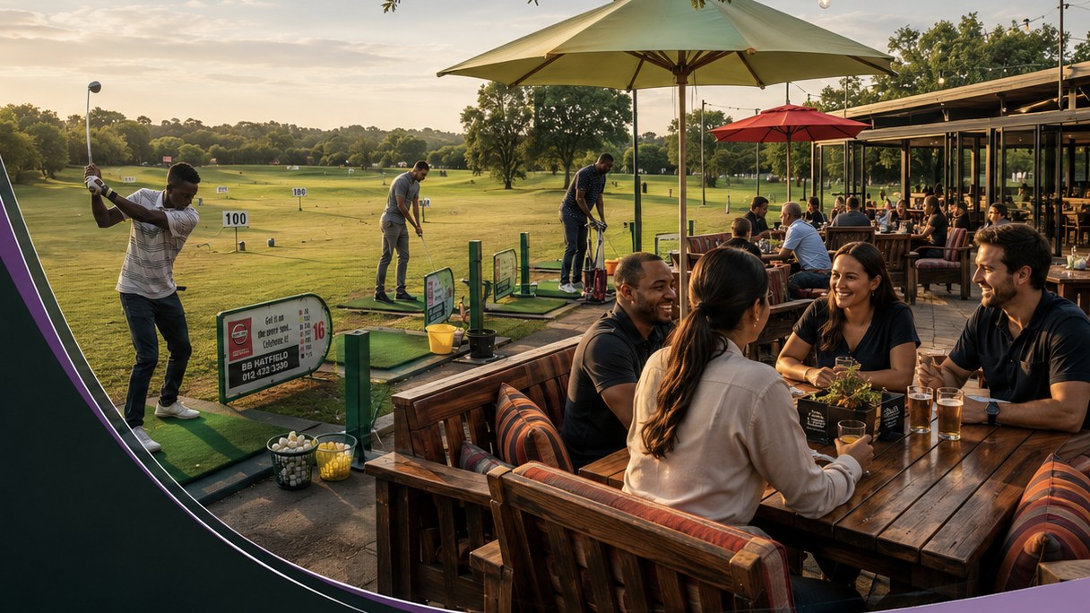 Friends gather at a terrace table beside active driving-range bays